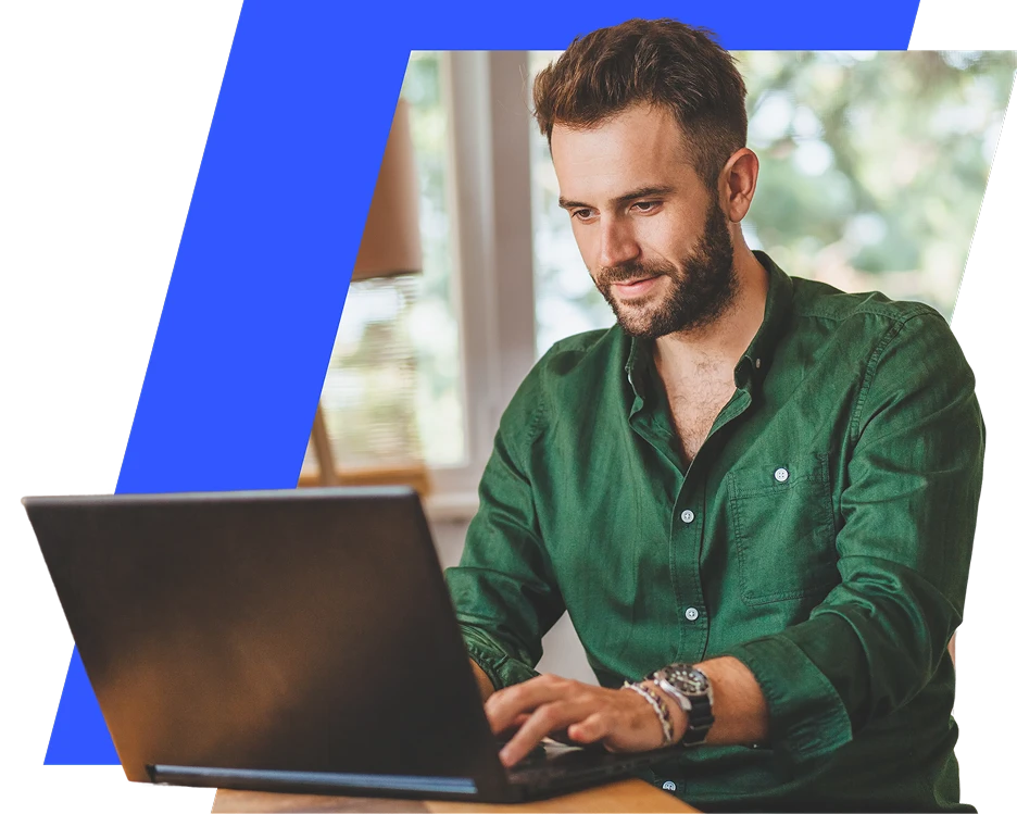 VEXI brand lifestyle image featuring a focused man in a green button-down shirt typing on a laptop, framed within a sharp geometric layout with a bright blue accent stripe.