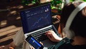 Stocks_Laptop_Phone_Woman