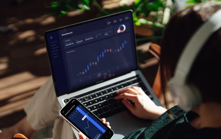 Stocks_Laptop_Phone_Woman